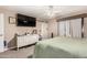 Comfortable bedroom with a queen-size bed and large TV at 1018 W Ivanhoe St, Chandler, AZ 85224