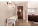 Bright entryway with a white console table and a wooden door at 1018 W Ivanhoe St, Chandler, AZ 85224