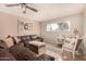 Sunlit living room with brown leather sectional and decorative accents at 1018 W Ivanhoe St, Chandler, AZ 85224