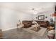 Spacious living room with leather sectional and wooden coffee table at 1018 W Ivanhoe St, Chandler, AZ 85224