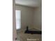 Bright bedroom with large window and wood-look floors at 11042 N 28Th Dr # 136, Phoenix, AZ 85029