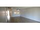 Living room with kitchen pass-through and wood floors at 11042 N 28Th Dr # 136, Phoenix, AZ 85029