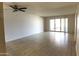 Bright living room with sliding glass doors to patio at 11042 N 28Th Dr # 136, Phoenix, AZ 85029