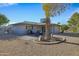 Relaxing backyard patio with seating area and desert landscaping at 12424 W Bluestem Dr, Sun City West, AZ 85375