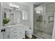 Modern bathroom with a walk-in shower and white vanity at 12424 W Bluestem Dr, Sun City West, AZ 85375