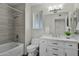 Updated bathroom with a soaking tub, modern vanity, and tile shower at 12424 W Bluestem Dr, Sun City West, AZ 85375