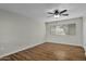 Bright bedroom with wood-look floors and window coverings at 12424 W Bluestem Dr, Sun City West, AZ 85375