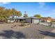 Single story home with gray exterior, landscaping, and a two-car garage at 12424 W Bluestem Dr, Sun City West, AZ 85375