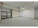 Garage with built-in shelving and ample storage space at 12424 W Bluestem Dr, Sun City West, AZ 85375