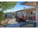 Patio with seating for four and a gate at 12424 W Bluestem Dr, Sun City West, AZ 85375