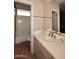 Bathroom with vanity, sink, and adjacent bathtub at 12887 N 135 St, Scottsdale, AZ 85259