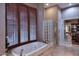 Relaxing bathroom with a large soaking tub and walk-in shower at 12887 N 135 St, Scottsdale, AZ 85259