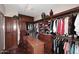 Spacious walk-in closet with custom built-ins and organizers at 12887 N 135 St, Scottsdale, AZ 85259