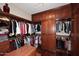 Large walk-in closet with ample shelving and hanging space at 12887 N 135 St, Scottsdale, AZ 85259