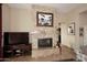 Stone fireplace with a large framed painting above it at 12887 N 135 St, Scottsdale, AZ 85259