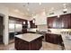 Gourmet kitchen with stainless steel appliances and granite island at 12887 N 135 St, Scottsdale, AZ 85259