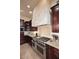 View of the kitchen's professional range and tile backsplash at 12887 N 135 St, Scottsdale, AZ 85259