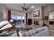 Living room features a fireplace, large windows, and mountain views at 12887 N 135 St, Scottsdale, AZ 85259