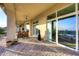 Spacious covered patio with seating and sliding glass doors at 12887 N 135 St, Scottsdale, AZ 85259