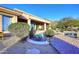 Peaceful patio with seating, adjacent to pool and mountain backdrop at 12887 N 135 St, Scottsdale, AZ 85259