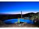 Inviting pool and spa at twilight with mountain vistas at 12887 N 135 St, Scottsdale, AZ 85259