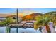 Luxury pool and spa with mountain views at sunset at 12887 N 135 St, Scottsdale, AZ 85259