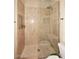 Large walk-in shower with glass enclosure and neutral tile at 12887 N 135 St, Scottsdale, AZ 85259