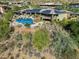 Aerial view of house with pool and solar panels at 12950 N 119Th St, Scottsdale, AZ 85259