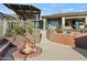 Relaxing backyard with fire pit, covered patio, and stone accents at 12950 N 119Th St, Scottsdale, AZ 85259