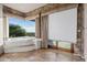 Bathroom with corner bathtub and mountain views at 12950 N 119Th St, Scottsdale, AZ 85259