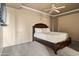 Cozy bedroom with a queen bed, ceiling fan, and neutral color scheme at 12950 N 119Th St, Scottsdale, AZ 85259