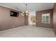 Bright dining room with chandelier and views to backyard at 12950 N 119Th St, Scottsdale, AZ 85259