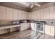 Bright laundry room with ample cabinet space and new appliances at 12950 N 119Th St, Scottsdale, AZ 85259