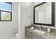 Modern bathroom with granite vanity, large mirror, and updated fixtures at 13222 E Ranch Gate Rd, Scottsdale, AZ 85255