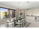 Modern dining room with large windows and access to backyard at 13222 E Ranch Gate Rd, Scottsdale, AZ 85255