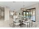 Elegant dining area with sliding doors to backyard and views at 13222 E Ranch Gate Rd, Scottsdale, AZ 85255