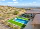 An inviting rectangular pool with artificial turf and a stone border at 13222 E Ranch Gate Rd, Scottsdale, AZ 85255