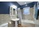 Updated bathroom with subway tile and pedestal sink at 1325 W Lynwood St, Phoenix, AZ 85007