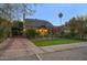 Brick home with a covered carport and spacious yard at 1325 W Lynwood St, Phoenix, AZ 85007