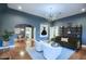 Living room with hardwood floors, comfortable seating, and built-in shelving at 1325 W Lynwood St, Phoenix, AZ 85007