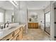 Elegant bathroom featuring a soaking tub, shower, and wood cabinets at 13813 W Monterey Way, Avondale, AZ 85392