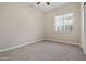 Bedroom with carpeted floor and window with blinds at 13813 W Monterey Way, Avondale, AZ 85392