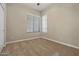 Simple bedroom with carpeted floor and ceiling fan at 13813 W Monterey Way, Avondale, AZ 85392