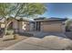 Front view of a house with a two-car garage and neutral color scheme at 13813 W Monterey Way, Avondale, AZ 85392