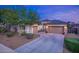 Two-story house with a two-car garage and landscaped front yard at 13813 W Monterey Way, Avondale, AZ 85392