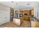 Kitchen boasts granite countertops, wood cabinets, and island at 13813 W Monterey Way, Avondale, AZ 85392