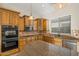 Kitchen features granite countertops and stainless steel appliances at 13813 W Monterey Way, Avondale, AZ 85392