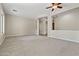 Spacious living room with carpeted floors and lots of natural light at 13813 W Monterey Way, Avondale, AZ 85392