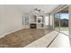 Bright living room with tile floors, fireplace, and sliding glass doors leading to the backyard at 13813 W Monterey Way, Avondale, AZ 85392