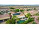 Single story home with solar panels, pool, and lush landscaping at 13827 W Junipero Dr, Sun City West, AZ 85375